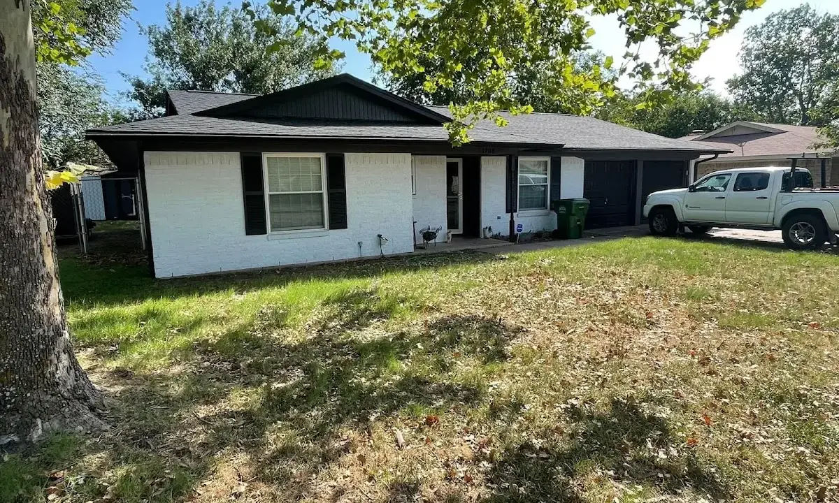 Professional roofing crew working on a residential roof in Hazel Park